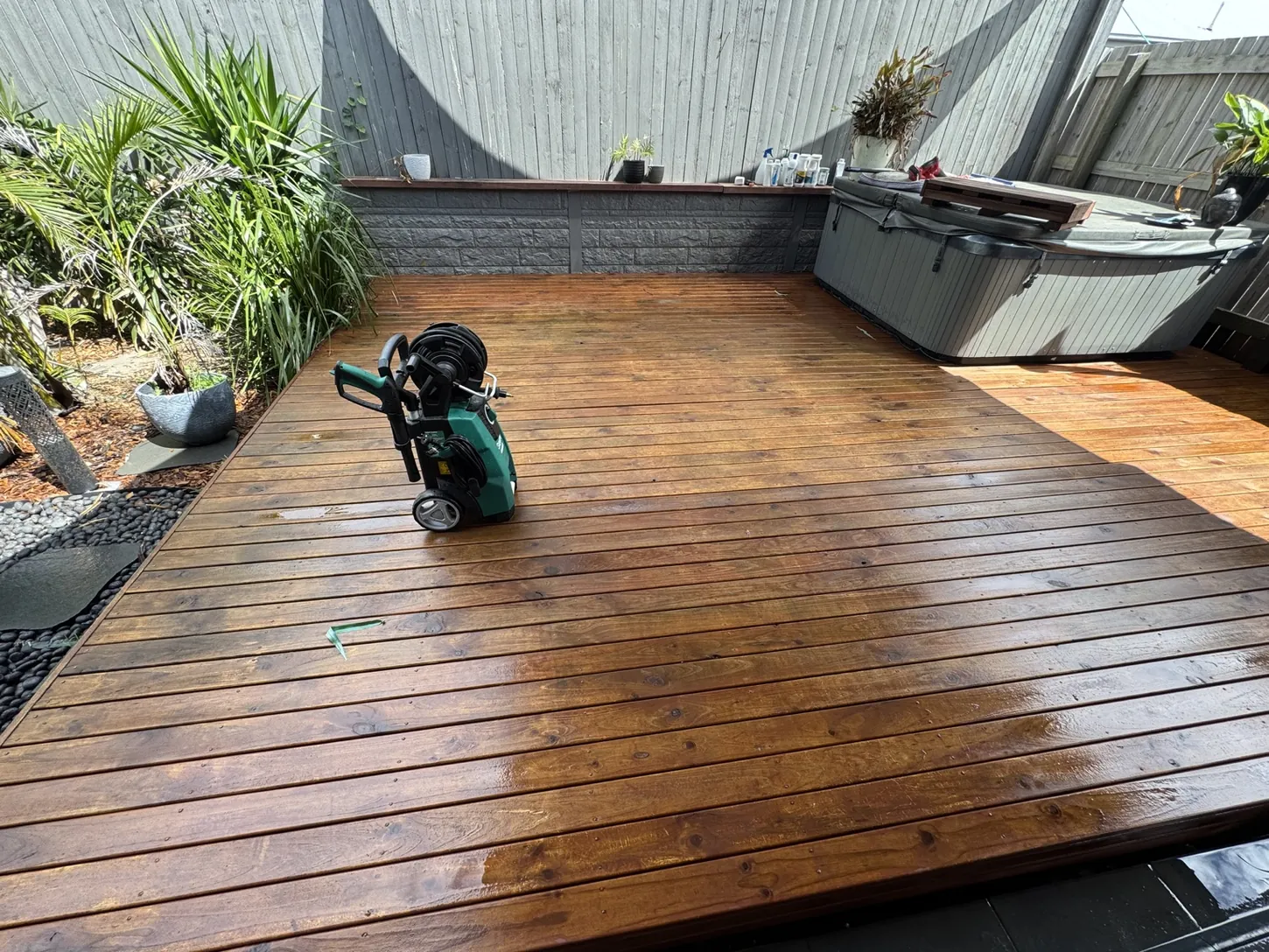 Timber deck surface cleaned with pressure washing equipment