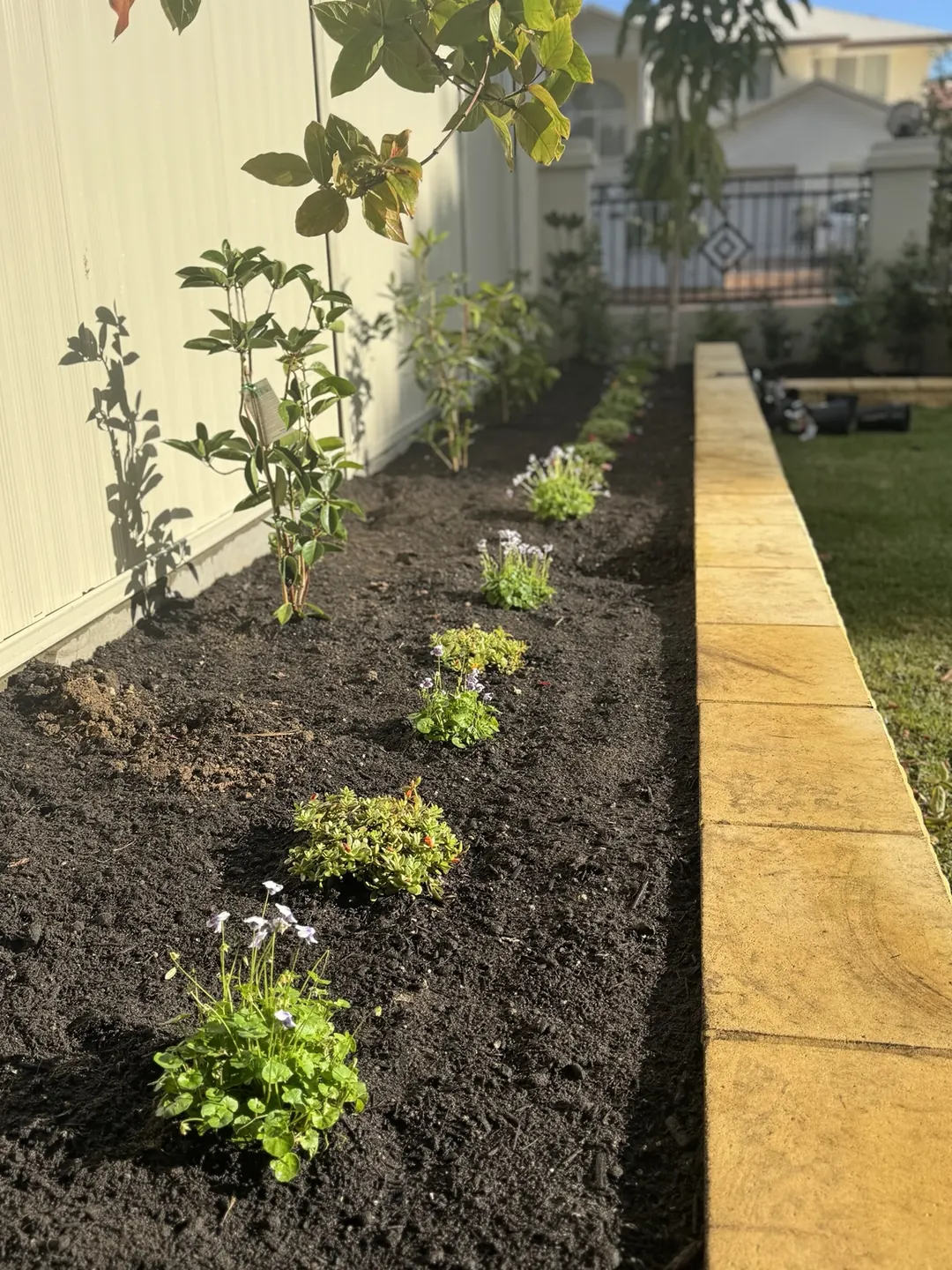 Fresh Garden Bed Planting — completed outdoor maintenance by Greenstone Outdoor Solutions